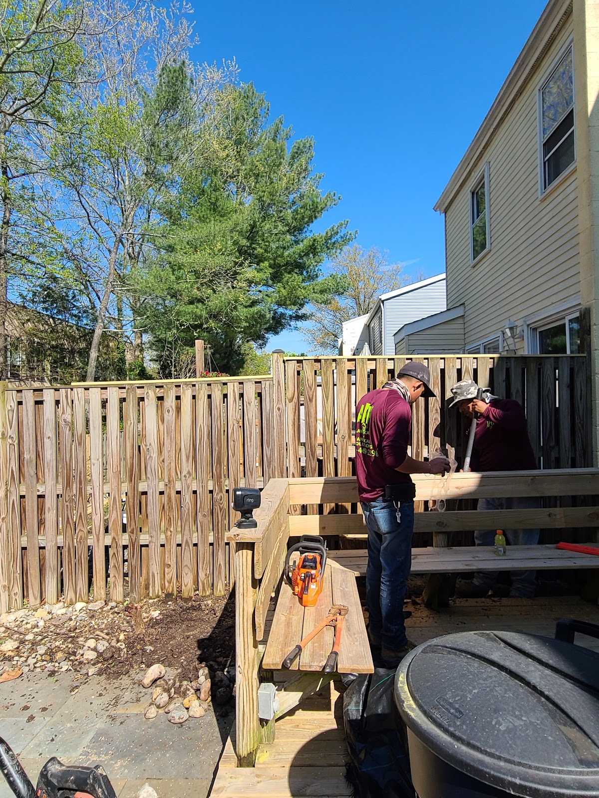 The APH crew in branded shirts building an outdoor project in Northern Virginia